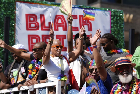 Participants dance on a float during the World Pride parade, Saturday, June 7, 2025, in Washington. (AP Photo/Mark Schiefelbein)
