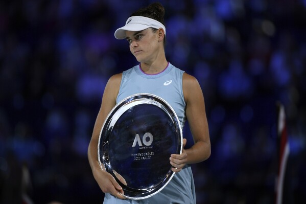FILE - United States' Jennifer Brady holds her runners-up trophy after she lost to Japan's Naomi Osaka in the women's singles final at the Australian Open tennis championship in Melbourne, Australia, Feb. 20, 2021. Brady is one of several players who recently returned to the tennis tour after time away, helping make this the year of comebacks at the 2023 U.S. Open, which was scheduled to begin in New York on Monday, Aug, 28, 2023. (AP Photo/Andy Brownbill, File)
