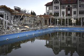 A damaged restaurant is seen after Russian shelling hit in Zaporizhzhia, Ukraine, Saturday, March 18, 2023. (AP Photo/Andriy Andriyenko)