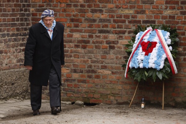 Holocaust survivor, Stanislaw Zalewski, attends a wreath lying ceremony in front of the Death Wall in the former Nazi German concentration and extermination camp Auschwitz during ceremonies marking the 78th anniversary of the liberation of the camp in Oswiecim, Poland, Jan. 27, 2023.(AP Photo/Michal Dyjuk, File)