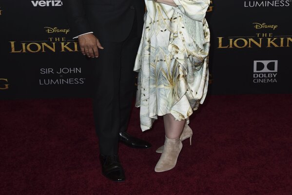 Keegan-Michael Key, left, and Elisa Pugliese arrive at the world premiere of "The Lion King" on Tuesday, July 9, 2019, at the Dolby Theatre in Los Angeles. (Photo by Jordan Strauss/Invision/AP)