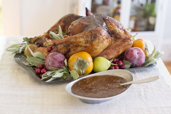 FILE - A barbecue spiced turkey appears in Concord, N.H., on Oct. 27, 2014. The Associated Press-NORC Center for Public Affairs Research looks at the state of the country's Thanksgiving favorites. (AP Photo/Matthew Mead, File)