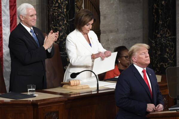 FILE - House Speaker Nancy Pelosi of Calif., tears her copy of President Donald Trump's s State of the Union address after he delivered it to a joint session of Congress on Capitol Hill in Washington, Feb. 4, 2020, as Vice President Mike Pence is at left. House Speaker Kevin McCarthytold reporters he “won't tear up the speech” as Pelosi dramatically did after President Donald Trump delivered his final State of the Union address in 2020. (AP Photo/Susan Walsh, File)