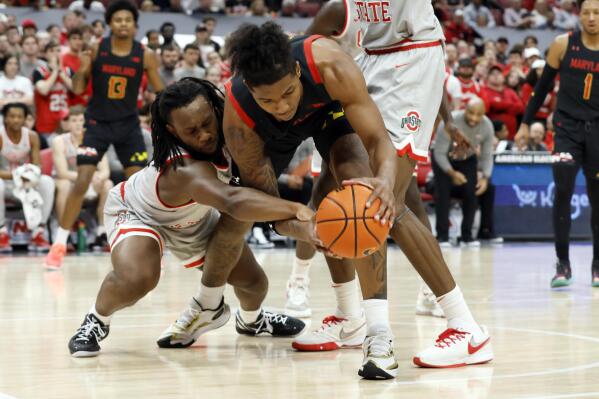 Ohio State's Bruce Thornton, left, and Maryland's Julian Reese fight for a loose ball during the first half of an NCAA college basketball game Wednesday, March 1, 2023, in Columbus, Ohio. (AP Photo/Jay LaPrete)