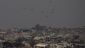 Parachutes drop humanitarian aid over the northern Gaza Strip, as seen from southern Israel, Sunday, March 17, 2024. (AP Photo/Ariel Schalit)