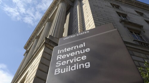FILE - The Internal Revenue Service building stands in Washington on March 22, 2013. The rapidly expanding landscape of nonprofit collectives paying college athletes to promote charities has been hit with a potentially seismic disruption. A 12-page memo from the Internal Revenue Service released in June 2023 determined that in many cases, the nonprofit collectives may not qualify as tax-exempt if their main purpose is paying players instead of supporting charitable works. (AP Photo/Susan Walsh, File)