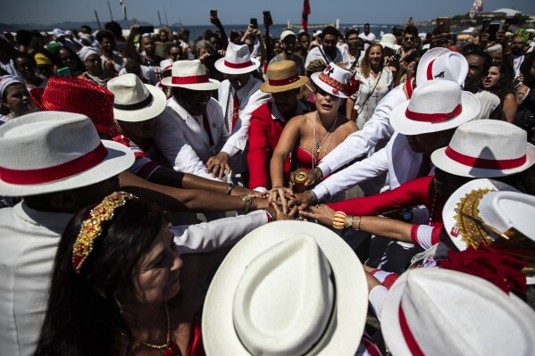 A cultural and religious group of Afro-Brazilian cults performs during a Defense of Religious Freedom march at Copacabana Beach in Rio de Janeiro, Brazil, Sunday, Sept. 17, 2023. (AP Photo/Bruna Prado)