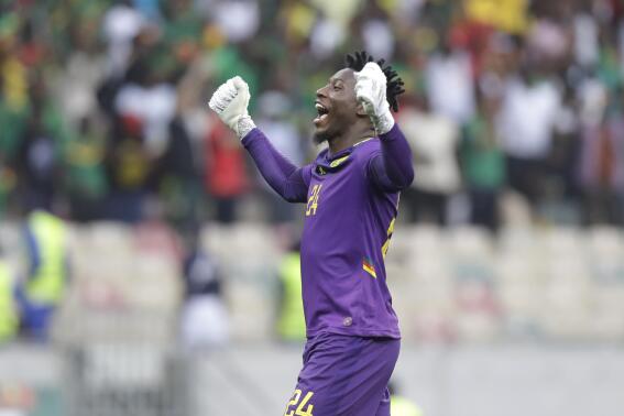 Cameroon's goalkeeper Andre Onana celebrates after goal is scored during the African Cup of Nations 2022 quarter-final soccer match between Gambia and Cameroon at the Japoma Stadium in Douala, Cameroon, Saturday, Jan. 29, 2022. (AP Photo/Sunday Alamba)