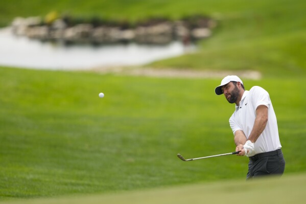 Scottie Scheffler chips to the green on the 18th hole during a practice round for the PGA Championship golf tournament at the Valhalla Golf Club, Wednesday, May 15, 2024, in Louisville, Ky. (AP Photo/Matt York)