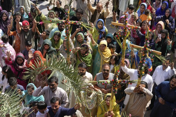 Pakistani Christians attend a Palm Sunday Mass in St. Anthony Church in Lahore, Pakistan, Sunday, April 13, 2025. (AP Photo/K.M. Chaudary)