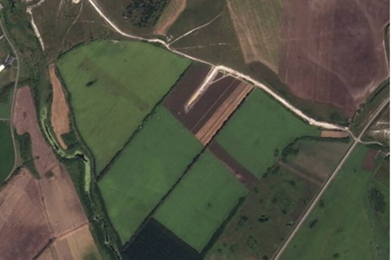 This Planet Labs satellite image shows a field in the Belgorod Oblast, Russia, in August 2023. By June 2024 a 2,000-meter (yard) runway was built, AP analysis found. Construction began in the late summer of 2023 during the failed Ukrainian counteroffensive. (Planet Labs via AP)