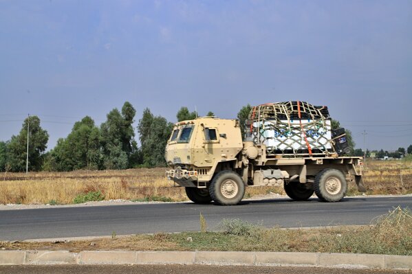 A U.S. military vehicle, part of a convoy, arrives near Dahuk, Iraqi, Monday, Oct. 21, 2019. Defense Secretary Mark Esper said Monday that under the current plan all U.S. troops leaving Syria will go to western Iraq and the military will continue to conduct operations against the Islamic State group to prevent its resurgence. (AP Photo)