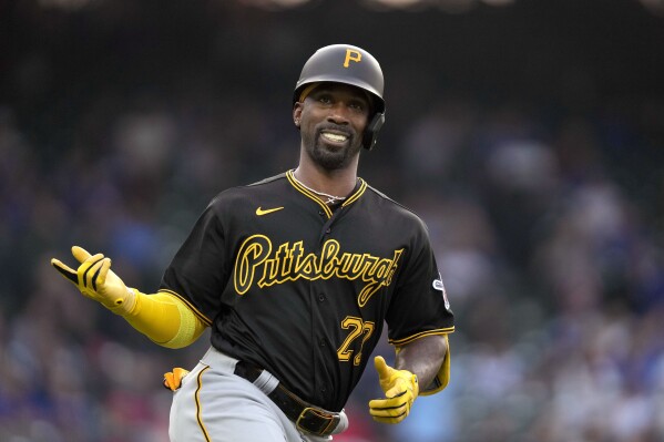 FILE - Pittsburgh Pirates' Andrew McCutchen heads to first and celebrates his leadoff home run off Chicago Cubs pitcher Drew Smyly during the first inning of a baseball game Wednesday, June 14, 2023, in Chicago. McCutchen isn't going anywhere. The Pittsburgh Pirates outfielder/designated hitter is remaining in his adopted hometown after agreeing to a one-year contract for the 2024 season worth $5 million, a person with knowledge of the deal told The Associated Press Tuesday, Dec. 19. (AP Photo/Charles Rex Arbogast, File)