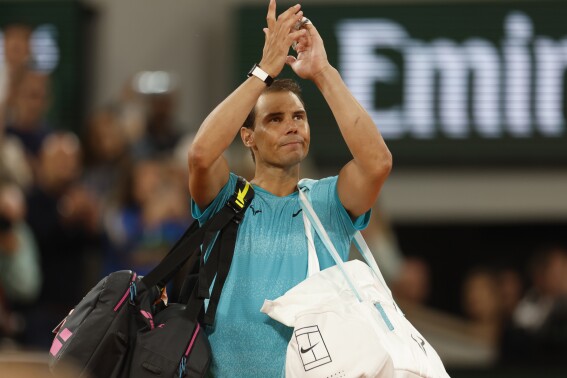 Spain's Rafael Nadal waves as he leaves the court after losing against Germany's Alexander Zverev during their first round match of the French Open tennis tournament at the Roland Garros stadium in Paris, Monday, May 27, 2024. (AP Photo/Jean-Francois Badias)