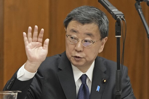 Japan's former Chief Cabinet Secretary Hirokazu Matsuno attends a political ethics committee at parliament in Tokyo Friday, March 1, 2024. Two former Cabinet ministers belonging to Japan’s governing party’s key faction behind a major corruption scandal that has rocked the government renewed denial they had any role in running slush funds at a political ethics hearing Friday, a day after Prime Minister Fumio Kishida’s appearance that gave no new details, deepening speculation that the party just wants to get it over with and rush the passage of a budget bill. (Japan Pool/Kyodo News via AP)