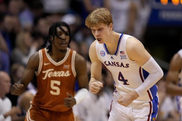Kansas guard Gradey Dick (4) reacts after taking a shot during the second half of an NCAA college basketball game Texas Monday, Feb. 6, 2023, in Lawrence, Kan. Kansas won 88-80. (AP Photo/Charlie Riedel)