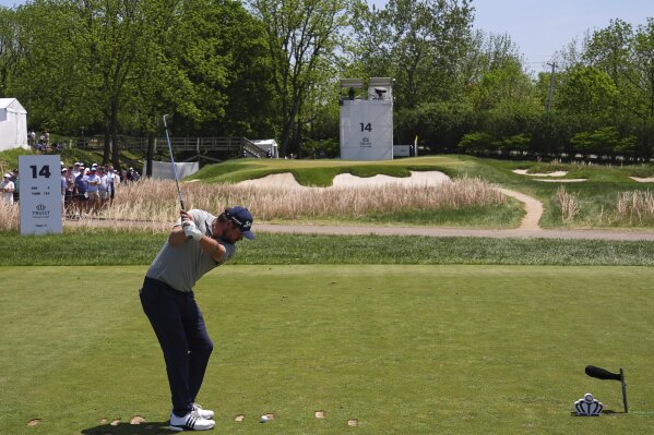 Andrew Novak hits on the 14th hole during the final round of the Truist Championship golf tournament at the Philadelphia Cricket Club, Sunday, May 11, 2025, in Flourtown. (AP Photo/Matt Rourke)