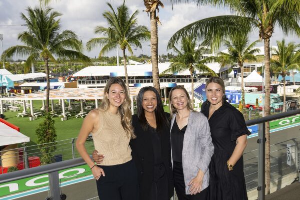 In this image provided by Hard Rock Stadium, from left, Katharina Nowak, Sydney McClain, Natalie Clark and Melanie Cabassol pose, Tuesday, April 29, 2025, Miami International Autodrome in Miami Gardens, Fla. (Peter McMahon/Hard Rock Stadium via AP)