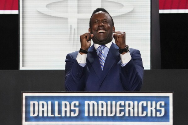 Dallas Mavericks' Rolando Blackman celebrates after NBA Deputy Commissioner Mark Tatum announced that the Mavericks won the first pick in the NBA basketball draft lottery in Chicago, Monday, May 12, 2025. (AP Photo/Nam Y. Huh)