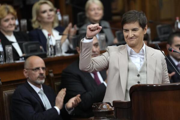 Serbia's prime minister designate Ana Brnabic salutes before laying out a plan for the new government to the parliament members, six months after the elections held on April, in Belgrade, Serbia, Tuesday, Oct. 25, 2022. (AP Photo/Darko Vojinovic)