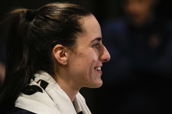 Indiana Fever guard Caitlin Clark speaks with the media after the WNBA basketball team practiced in Indianapolis, Sunday, April 28, 2024. (AP Photo/Michael Conroy)