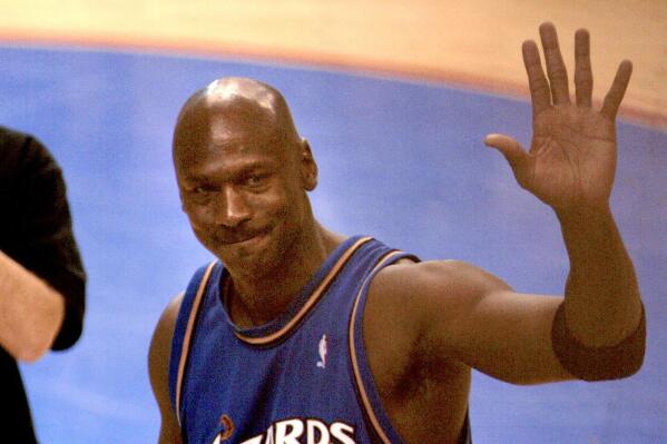 FILE - Washington Wizards Michael Jordan waves as he walk off the court at the end of the game against the Philadelphia 76ers Wednesday, April 16, 2003, in Philadelphia. It was Jordan's last NBA game.(AP Photo/Miles Kennedy, File)