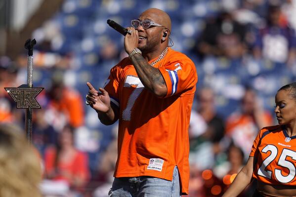 FILE - Singer Flo Rida performs at halftime during of an NFL football game between the New York Jets and the Denver Broncos, Sunday, Sept. 26, 2021, in Denver. Hip hop artist Flo Rida, whose real name is Tramar Dillard, was awarded $82.6 million on Wednesday, Jan. 18, 2022, after a South Florida jury found that the makers of Celsius energy drinks breached a contract with the rapper and singer and tried to hide money from him. (AP Photo/Jack Dempsey, File)