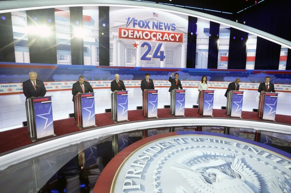 FILE - Republican presidential candidates, from left, former Arkansas Gov. Asa Hutchinson, former New Jersey Gov. Chris Christie, former Vice President Mike Pence, Florida Gov. Ron DeSantis, businessman Vivek Ramaswamy, former U.N. Ambassador Nikki Haley, Sen. Tim Scott, R-S.C., and North Dakota Gov. Doug Burgum stand on stage before a Republican presidential primary debate hosted by FOX News Channel Wednesday, Aug. 23, 2023, in Milwaukee. (AP Photo/Morry Gash, File)