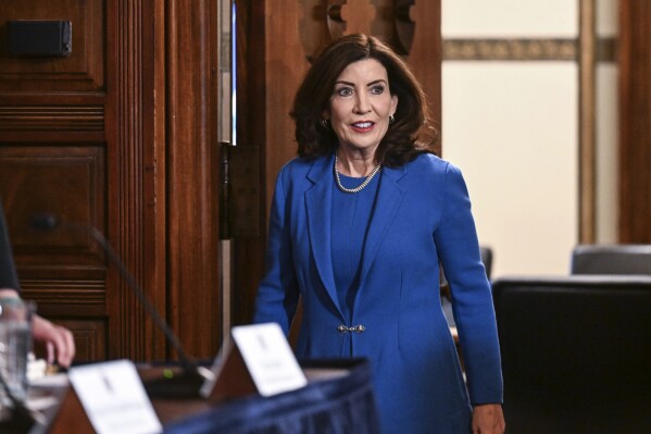FILE - New York Gov. Kathy Hochul arrives at the Red Room at the state Capitol, Jan. 16, 2024, in Albany, N.Y. Gov. Hochul signed into law a bill Tuesday, Jan. 30, 2024 that expands the legal definition of rape to include nonconsensual vaginal, anal, and oral sexual contact. (AP Photo/Hans Pennink)