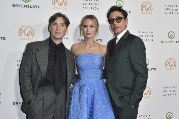 Cillian Murphy, from left, Emily Blunt, and Robert Downey Jr. arrive at the 35th Annual Producers Guild Awards on Sunday, Feb. 25, 2024, at The Ray Dolby Ballroom in Los Angeles. (Photo by Richard Shotwell/Invision/AP)