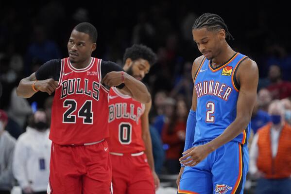 Oklahoma City Thunder guard Shai Gilgeous-Alexander (2) reacts in front of Chicago Bulls forward Javonte Green (24) after missing a basket in the final seconds of the an NBA basketball game Monday, Jan. 24, 2022, in Oklahoma City. (AP Photo/Sue Ogrocki)