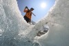 Matthias Huss, of the Federal Institute of Technology in Zurich and glacier monitoring group GLAMOS, stands at the Rhone Glacier near Goms, Switzerland, June 10, 2025. (AP Photo/Matthias Schrader)