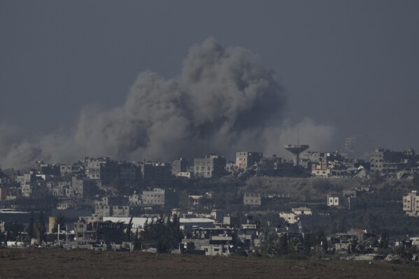 Smoke rises from the Gaza Strip after Israeli strikes on Saturday, Dec. 9, 2023. (APPhoto/Leo Correa)