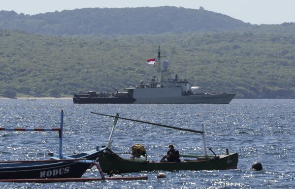 Indonesian Navy ship KRI Singa sails to take part in the search for submarine KRI Nanggala that went missing while participating in a training exercise on Wednesday, off Banyuwangi, East Java, Indonesia, Thursday, April 22, 2021. Indonesia's navy ships are intensely searching the waters where one of its submarines was last detected before it disappeared, as neighboring countries are set to join the complex operation. (AP Photo)