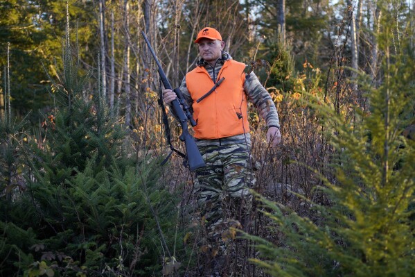 FILE - Jared Bornstein walks through brush while hunting Saturday, Nov. 11, 2023, in Turner, Maine. Maine’s highest court ruled Thursday, March 28, 2024, that the state’s longstanding ban on Sunday hunting is constitutional. (AP Photo/Robert F. Bukaty, File)