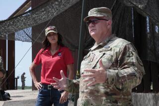 FILE - South Dakota Gov. Kristi Noem visited the U.S. border with Mexico on Monday, July 26, 2021, near McAllen, Texas. Noem described the U.S. border with Mexico as a “war zone” last year when she sent dozens of state National Guard troops there. Records show the South Dakota troops didn't seize any drugs. (AP Photo/Stephen Groves, File)