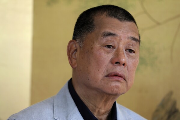 FILE - Hong Kong media tycoon Jimmy Lai pauses during an interview in Hong Kong on July 1, 2020. The trial of Hong Kong’s most famous activist publisher who was arrested under China’s crackdown on dissidents will start on Monday, Dec. 18, 2023 after being delayed for over a year. Jimmy Lai broke into the city’s once freewheeling media world about three decades ago, armed with the belief that delivering information is equal to protecting freedom. (AP Photo/Vincent Yu, File)