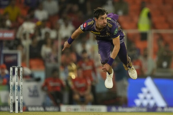 Kolkata Knight Riders' Mitchell Starc bowls a delivery during the Indian Premier League qualifier cricket match between Kolkata Knight Riders and Sunrisers Hyderabad in Ahmedabad, India, Tuesday, May 21, 2024. (AP Photo/Ajit Solanki)