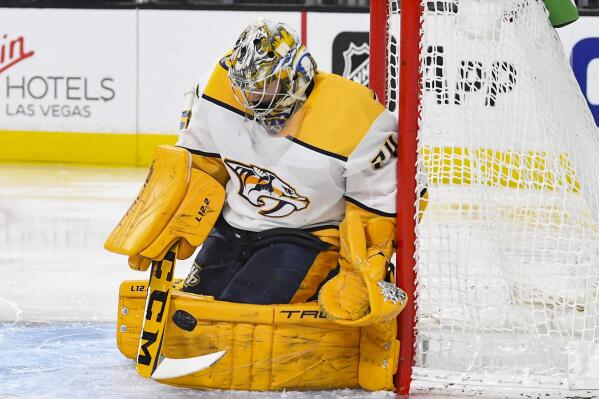 Nashville Predators goalie Juuse Saros makes a save against the Vegas Golden Knights during the second period of an NHL game Tuesday, Jan. 4, 2022, in Las Vegas. (AP Photo/Sam Morris)