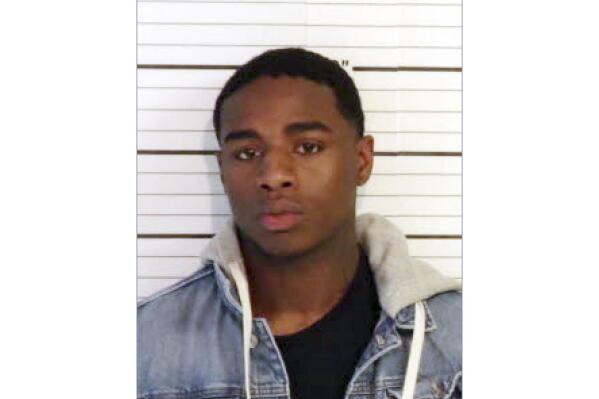 This image released by the U.S. Marshals Service shows Justin Johnson. An arrest warrant has been issued for Johnson, 23, in connection with the the Nov. 17, 2021, shooting fatal shooting of rapper Young Dolph, who was gunned down in a daylight ambush at a popular cookie shop in November in his hometown of Memphis, authorities said Wednesday, Jan. 5, 2022. (U.S. Marshals Service via AP)