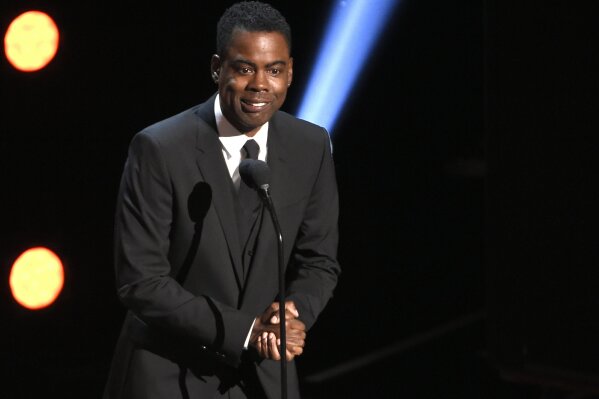 
              FILE - In this March 30, 2019 file photo, Chris Rock presents the award for outstanding comedy series at the 50th annual NAACP Image Awards at the Dolby Theatre in Los Angeles. Netflix is launching its first audio venture that will feature the video streaming service’s comedy programming on SiriusXM. The companies on Wednesday, April 10 announced “Netflix Is A Joke Radio” will feature highlights from such comedians as Rock, Dave Chappelle, Ricky Gervais, Sarah Silverman, Jerry Seinfeld and Wanda Sykes. The channel also will feature segments from future stand-up specials and clips from Netflix’s comedy talk shows.  (Photo by Chris Pizzello/Invision/AP, File)
            