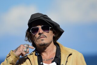 FILE - In this file photo dated Sunday, Sept. 20, 2020, US actor and film producer Johnny Deep during the photocall for his film "Crock of Gold: A Few Rounds with Shane Macgoman" at the 68th San Sebastian Film Festival, in San Sebastian, northern Spain. Appeal judges said the Hollywood star cannot challenge the High Court’s rejection of his libel lawsuit against publisher of The Sun newspaper for labeling him a “wife beater” in an article. High Court Justice Andrew Nicol ruled in November that allegations against Depp, made in a April 2018 article, were “substantially true.” The judges said Thursday that the earlier court hearing was “full and fair” and the justice’s conclusions “have not been shown even arguably to be vitiated by any error of  approach or mistake of law.” (AP Photo/Alvaro Barrientos, File)