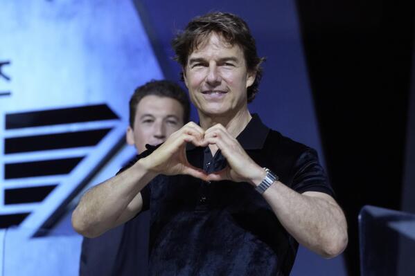 Tom Cruise gestures during a press conference to promote his latest movie Top Gun: Maverick in Seoul, South Korea, Monday, June 20, 2022. The movie is to be released in the country on June 22. (AP Photo/Ahn Young-joon)