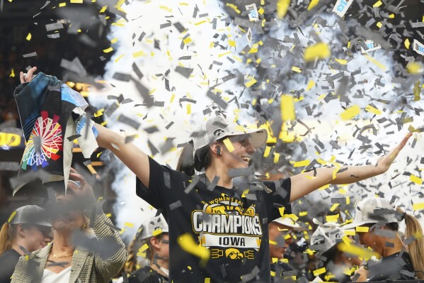 Iowa guard Caitlin Clark celebrates after the overtime win of an NCAA college basketball game against Nebraska in the final of the Big Ten women's tournament Sunday, March 10, 2024, in Minneapolis. (AP Photo/Abbie Parr)