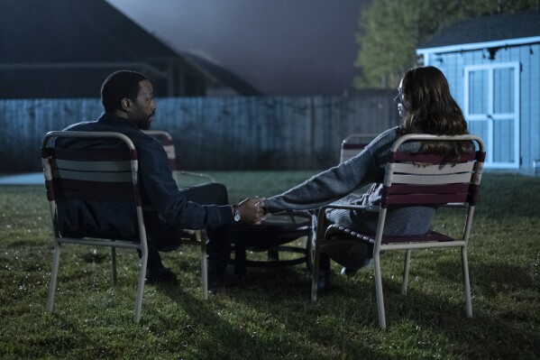 This image released by Neon shows Chiwetel Ejiofor, left, and Karen Gillan in a scene from "The Life of Chuck." (Neon via AP)