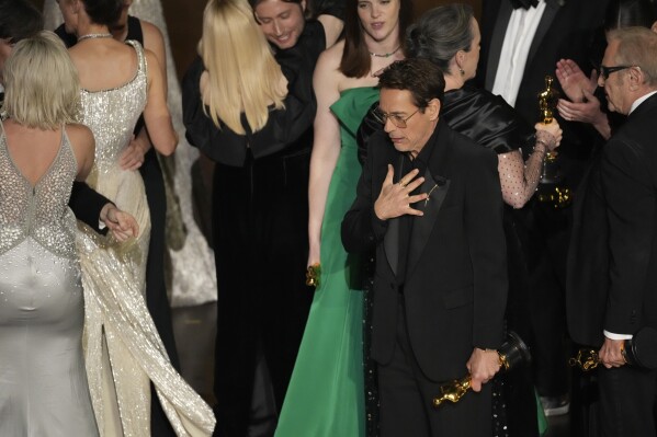 Robert Downey Jr. reacts as the cast and crew of "Oppenheimer" accept the award for best picture during the Oscars on Sunday, March 10, 2024, at the Dolby Theatre in Los Angeles. (AP Photo/Chris Pizzello)