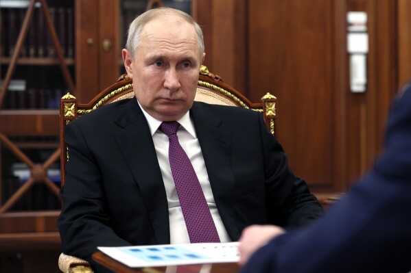 Russian President Vladimir Putin listens to Igor Shuvalov, chairman of the Russian state development corporation VEB.RF during their meeting at the Kremlin in Moscow, Russia, Wednesday, Aug. 30, 2023. (Gavriil Grigorov, Sputnik, Kremlin Pool Photo via AP)