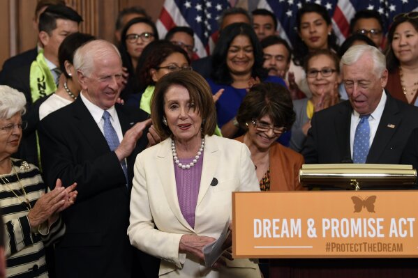 House Speaker Nancy Pelosi of Calif., center, is applauded after she spoke at an event on Capitol Hill in Washington, Tuesday, June 4, 2019, regarding the American Dream and Promise Act which offers a pathway to citizenship for those with Deferred Action for Childhood Arrivals (DACA), Temporary Protected Status (TPS), and Deferred Enforced Departure (DED) and similarly situated immigrants who have spent much of their lives in the United States. (AP Photo/Susan Walsh)