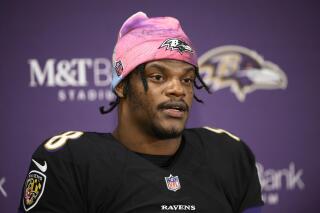 FILE - Baltimore Ravens quarterback Lamar Jackson (8) speaks to the media at a press conference after an NFL football game against the Cincinnati Bengals, Sunday, Oct. 9, 2022, in Baltimore. Lamar Jackson remained absent Wednesday, Jan. 4, 2023, from the portion of practice open to reporters. Baltimore's star quarterback hasn't practiced since injuring his knee Dec. 4 in the Ravens' victory over Denver. (AP Photo/Nick Wass, File)