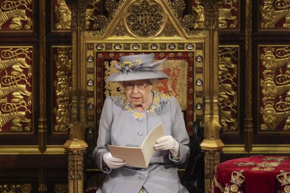 Britain's Queen Elizabeth II delivers a speech in the House of Lords during the State Opening of Parliament at the Palace of Westminster in London, Tuesday May 11, 2021. (Chris Jackson/Pool via AP)